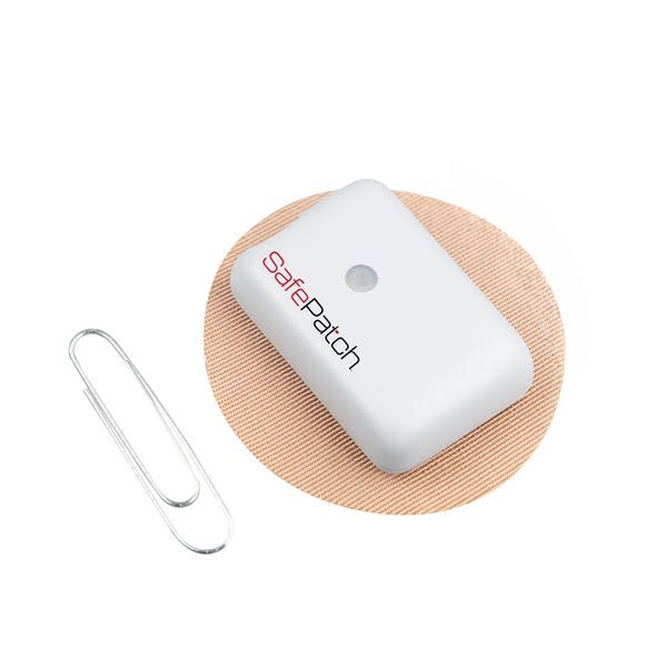 SafePatch device shown next to a paperclip for size comparison